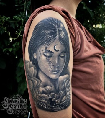 Tattoo done by artist Louie Abbott - These beautiful tattoos were done by our resident artist Louie Abbott. The tattoo on the left is a healed tattoo in that photo showing you how well this tattoo healed and how skilled our artist is. To see more work done by this artist and to learn more about us, visit us by clicking our website link.