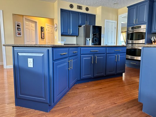 Kitchen Refinish - Transform your kitchen with stunning refinishing! This project features a dramatic upgrade from outdated wood tones to a sleek, modern navy blue. Professionally painted cabinets with a smooth, durable finish and elegant gold hardware breathe new life into the space. The result? A high-end, custom look without the cost of a full remodel. Elevate your kitchen’s style today!
