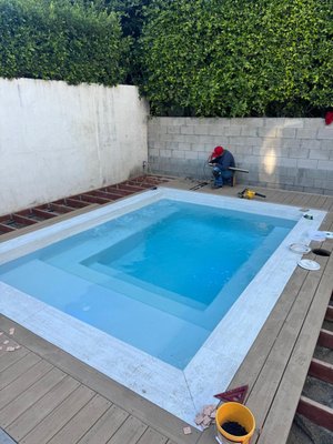 Beverly Hills Custom Spool - Custom Spool built with decking around with a custom stairs and white plaster Beverly Hills Custom Spool - Custom Spool built with decking around with a custom stairs and white plaster