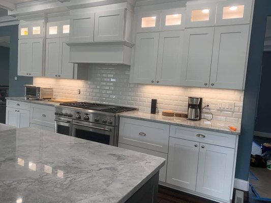 Decorative Lighting Installation - This lighting install was done in an old outdated kitchen.  The rest of the house had been updated but the kitchen stuck out like a sore thumb.  We went in and worked with the home owner and contractor to give the homeowners the kitchen of their dreams.  The under-cabinet lighting and in cabinet lighting made the kitchen a great focal point to this open concept layout.