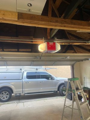 Garage Door Opener - This garage was installed to our customer on the same day he called us. After showing all the models we work with the customer choose a brand new Craftsman garage door opener with WIFI connection, to be able to open it from his personal phone.