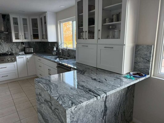 Kitchen Cabinet and Countertop Remodel l - 01.22.26 - ZIP: 92127 - This kitchen remodel features white cabinetry with glass-front upper cabinets and an appliance garage, a full-height backsplash, and a waterfall countertop. The before-and-after photos show the updated cabinetry, surfaces, and ceiling while the existing tile flooring was retained. Kitchen Cabinet and Countertop Remodel l - 01.22.26 - ZIP: 92127 - This kitchen remodel features white cabinetry with glass-front upper cabinets and an appliance garage, a full-height backsplash, and a waterfall countertop. The before-and-after photos show the updated cabinetry, surfaces, and ceiling while the existing tile flooring was retained.
