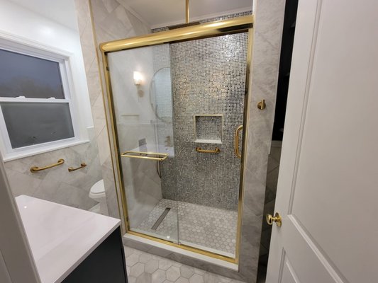 Bathroom Remodelation - Transform your bathroom into a golden oasis with MeyMax Construction, LLC! 🌟 From sleek tiling to opulent gold fixtures, every detail exudes elegance. Discover why our customers continued to choose us, check out our reviews! This is a vision of a bathroom created from our clients located in Plainfield, NJ.