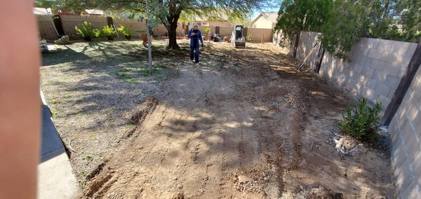 Over 20 years of different types of landscape rock removed - This customer purchased this house last year and the back yard had over 20 tons of landscape rock removed. Over 20 years of different types of landscape rock removed - This customer purchased this house last year and the back yard had over 20 tons of landscape rock removed.