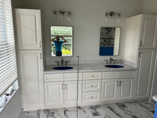 Full Bathroom Remodeling - This is one of the two bathrooms we made for this client. Quartz countertops, wood cabinets and premium tile.