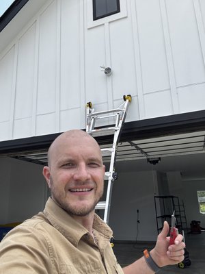 Outdoor Security Camera Installation - Installed a complete outdoor security camera system for a detached garage and home exterior. Routed new wiring through the attic, installed junction boxes, mounted cameras in multiple locations, secured all cables, and tested the entire system. The project included front and rear garage cameras, backyard corner coverage, and front corner surveillance to provide reliable, full-property security. All cameras were positioned for optimal viewing angles and verified for proper operation. Outdoor Security Camera Installation - Installed a complete outdoor security camera system for a detached garage and home exterior. Routed new wiring through the attic, installed junction boxes, mounted cameras in multiple locations, secured all cables, and tested the entire system. The project included front and rear garage cameras, backyard corner coverage, and front corner surveillance to provide reliable, full-property security. All cameras were positioned for optimal viewing angles and verified for proper operation.