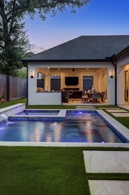San Bernardino Project - Our favorite Project yet. New pool and spa with a raised planter wall/waterfall. The artificial turf in between the concrete steps brought a home vibe to this pool. We used. a mini pebble finish for the interior and a precast copping! What a dream!