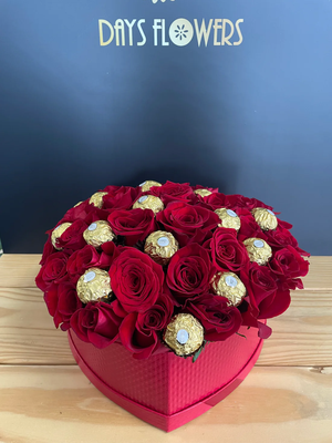 Romance in a Box - Surprise your sweetheart with this amazing gift box that contains 30 red roses and Ferrero Rocher chocolates. This is the ultimate expression of love and romance, as the roses symbolize passion and the chocolates are a treat for the senses. Whether it’s for an anniversary, a birthday, or just because, this gift box will make your partner feel special and appreciated.