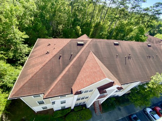 Roof Wash - Commercial - This apartment complex was in serious need of a soft wash! We provided Siding, Roof, and Breezeway Soft Washing to make this entire complex look as good as new in no time!