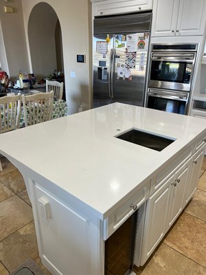 Silestone Miami Vena - This remodel was done on an old kitchen. We demolished previous countertops and installed Silestone; Miami Vena with a full backsplash using the same material. Kitchen looks bright and opened with the beautiful white island in the middle as well! Silestone Miami Vena - This remodel was done on an old kitchen. We demolished previous countertops and installed Silestone; Miami Vena with a full backsplash using the same material. Kitchen looks bright and opened with the beautiful white island in the middle as well!