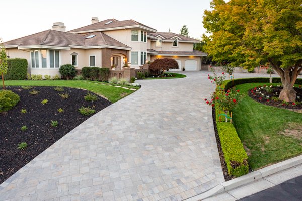 Driveway - Paver driveway work involves the installation of a driveway made from interlocking concrete or brick pavers. This process typically begins with thorough planning and design to ensure the driveway meets the homeowner's specifications and complements the overall aesthetic of the property. Driveway - Paver driveway work involves the installation of a driveway made from interlocking concrete or brick pavers. This process typically begins with thorough planning and design to ensure the driveway meets the homeowner's specifications and complements the overall aesthetic of the property.