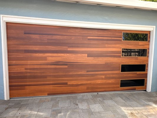 Plank Collection; Woodtone Accent Colors - If you like the look of wooden garage doors but don’t want the maintenance, a wood-look garage door could be the perfect match for your home.
The recessed grooves create subtle planks that add texture and depth to this contemporary door.
Made of durable, low-maintenance steel
Suitable for all climates
Insulated for thermal efficiency with R-values of R-10.29 or R-17.54
Comes with a limited lifetime warranty Plank Collection; Woodtone Accent Colors - If you like the look of wooden garage doors but don’t want the maintenance, a wood-look garage door could be the perfect match for your home.
The recessed grooves create subtle planks that add texture and depth to this contemporary door.
Made of durable, low-maintenance steel
Suitable for all climates
Insulated for thermal efficiency with R-values of R-10.29 or R-17.54
Comes with a limited lifetime warranty