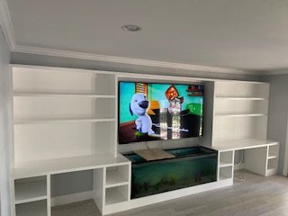 Carpentry: Entertainment Center - This Entertainment Center was done on a bare wall. Clients wanted to include a base for fish tank and two office spaces. Carpentry: Entertainment Center - This Entertainment Center was done on a bare wall. Clients wanted to include a base for fish tank and two office spaces.