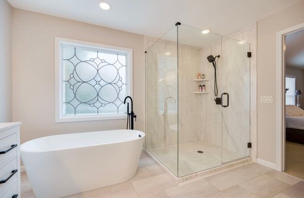Primary Bath Upgrade - We took this 1980s primary suite bathroom and brought it into the 2020s. A beautiful frameless shower surround, new double vanity, and free standing soaking tub. Primary Bath Upgrade - We took this 1980s primary suite bathroom and brought it into the 2020s. A beautiful frameless shower surround, new double vanity, and free standing soaking tub.