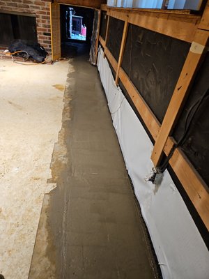 Split Level Basement - This split level home is something we see almost daily! This pour home was taking on so much water it was bubbling up through the floor! We pumped 20,000 gallons out from under this home in 1 day alone!