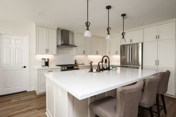 Warm-Toned Elegance - Contemporary Kitchen - Experience the pinnacle of refined design with our elegant kitchen remodel, seamlessly merging warm tones and contemporary aesthetics. Drawing inspiration from the inviting hues of cream and the clean lines of modern style, this kitchen exudes sophistication while embracing comfort.
Color Palette: The heart of this design lies in the warm-toned color palette. Shades of creamy beige and soft browns create an atmosphere of timeless elegance and coziness.
Cabinetry:
Cream Tone Cabinets: Custom-designed cabinetry in a creamy beige hue forms the foundation of the space. The neutral yet rich color adds depth and warmth to the kitchen.
Countertops:
Quartz Countertops: Polished quartz countertops in a complementary cream shade offer a durable and luxurious workspace. Their smooth surface adds a touch of modernity to the design.
Backsplash:
Crackled Subway Tile: The backsplash features crackled subway tiles in a coordinating cream tone. The textured surface adds visual interest while maintaining the overall elegant aesthetic.
Fixtures:
Oil Rubbed Bronze Fixtures: Oil rubbed bronze faucets and hardware provide a striking contrast to the creamy palette. Their aged appearance adds character and an element of timeless sophistication.
Appliances:
Stainless Steel Appliances: Sleek stainless steel appliances seamlessly blend with the contemporary design, adding a touch of modern functionality to the classic color scheme.
Lighting:
Pendant Lights: Pendant lights with clean lines and warm tones illuminate the space with a soft glow. These fixtures serve as both functional lighting and stylish accents.
Island:
Central Hub: The kitchen island, featuring a quartz countertop that mirrors the rest of the design, becomes a central gathering place for culinary endeavors and conversations.
Floors:
Luxury vinyl plank flooring: The floors are graced with rich hardwood in a warm brown tone, contributing to the overall sense of comfort and luxury.
Accents:
Metallic Accents: Delicate metallic accents, such as bronze-colored utensil holders or decorative bowls, tie in with the oil rubbed bronze fixtures, maintaining a cohesive theme.
Décor:
Subtle Artwork: Elegant artwork or sculptures with warm undertones can be strategically placed to add a touch of personal expression and sophistication.
Plants:
Indoor Greenery: Potted plants or fresh herbs placed by the windowsill infuse a natural element into the space, bringing life to the design.
Step into a world of contemporary elegance and inviting warmth. Our elegant kitchen remodel flawlessly merges the charm of cream tones with the sleek lines of modern design, creating a culinary haven that radiates both refinement and comfort. Elevate your cooking and entertaining experience in a space that effortlessly blends timeless beauty with contemporary convenience. Warm-Toned Elegance - Contemporary Kitchen - Experience the pinnacle of refined design with our elegant kitchen remodel, seamlessly merging warm tones and contemporary aesthetics. Drawing inspiration from the inviting hues of cream and the clean lines of modern style, this kitchen exudes sophistication while embracing comfort.
Color Palette: The heart of this design lies in the warm-toned color palette. Shades of creamy beige and soft browns create an atmosphere of timeless elegance and coziness.
Cabinetry:
Cream Tone Cabinets: Custom-designed cabinetry in a creamy beige hue forms the foundation of the space. The neutral yet rich color adds depth and warmth to the kitchen.
Countertops:
Quartz Countertops: Polished quartz countertops in a complementary cream shade offer a durable and luxurious workspace. Their smooth surface adds a touch of modernity to the design.
Backsplash:
Crackled Subway Tile: The backsplash features crackled subway tiles in a coordinating cream tone. The textured surface adds visual interest while maintaining the overall elegant aesthetic.
Fixtures:
Oil Rubbed Bronze Fixtures: Oil rubbed bronze faucets and hardware provide a striking contrast to the creamy palette. Their aged appearance adds character and an element of timeless sophistication.
Appliances:
Stainless Steel Appliances: Sleek stainless steel appliances seamlessly blend with the contemporary design, adding a touch of modern functionality to the classic color scheme.
Lighting:
Pendant Lights: Pendant lights with clean lines and warm tones illuminate the space with a soft glow. These fixtures serve as both functional lighting and stylish accents.
Island:
Central Hub: The kitchen island, featuring a quartz countertop that mirrors the rest of the design, becomes a central gathering place for culinary endeavors and conversations.
Floors:
Luxury vinyl plank flooring: The floors are graced with rich hardwood in a warm brown tone, contributing to the overall sense of comfort and luxury.
Accents:
Metallic Accents: Delicate metallic accents, such as bronze-colored utensil holders or decorative bowls, tie in with the oil rubbed bronze fixtures, maintaining a cohesive theme.
Décor:
Subtle Artwork: Elegant artwork or sculptures with warm undertones can be strategically placed to add a touch of personal expression and sophistication.
Plants:
Indoor Greenery: Potted plants or fresh herbs placed by the windowsill infuse a natural element into the space, bringing life to the design.
Step into a world of contemporary elegance and inviting warmth. Our elegant kitchen remodel flawlessly merges the charm of cream tones with the sleek lines of modern design, creating a culinary haven that radiates both refinement and comfort. Elevate your cooking and entertaining experience in a space that effortlessly blends timeless beauty with contemporary convenience.