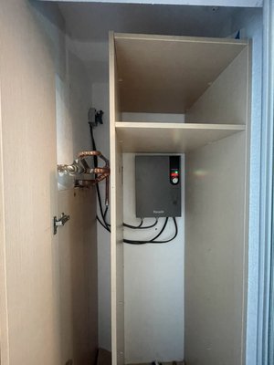 Water heater installation - The old water heater was dismantled, the cabinet was disassembled and assembled. The cold and hot water pipes were redone. A new water heater was installed.
