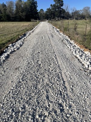 Rutted driveway - Severely rutted driveway. Graded it and put swales to help with drainage issues.