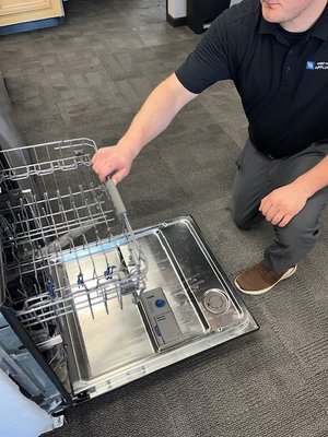 Dishwasher Repair in Eden Prairie - In Eden Prairie, MN, we performed a maintenance job on a dishwasher, where we reseated the lower rack to ensure proper motion and alignment. This service required the technician to open the dishwasher door fully to access the slide rails. With the lower rack removed, he checked the wheels and the rail's condition, making sure there were no obstructions. The technician's action aimed to guarantee that the rack slides in and out smoothly, which is crucial for the dishwasher's efficient loading and operation. No parts were replaced, indicating the issue was likely a minor misalignment or a track obstruction, common in routine dishwasher maintenance. Dishwasher Repair in Eden Prairie - In Eden Prairie, MN, we performed a maintenance job on a dishwasher, where we reseated the lower rack to ensure proper motion and alignment. This service required the technician to open the dishwasher door fully to access the slide rails. With the lower rack removed, he checked the wheels and the rail's condition, making sure there were no obstructions. The technician's action aimed to guarantee that the rack slides in and out smoothly, which is crucial for the dishwasher's efficient loading and operation. No parts were replaced, indicating the issue was likely a minor misalignment or a track obstruction, common in routine dishwasher maintenance.