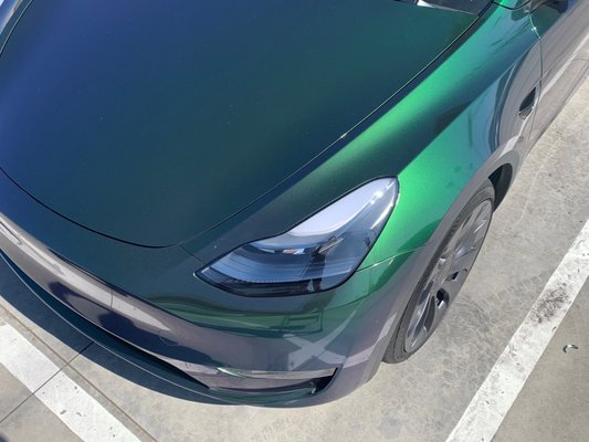 Tesla Model Y Full Vehicle Wrap - This Tesla Model Y came in for a complete make over. We wrapped the vehicle in Avery Dennison SW900 Gloss Hidden Forest. The final result was flawless and the customer was over the moon. Thanks to our low overhead and efficient operations, we pass those savings to customers. For the best work at the lowest price, call Ace Auto Tint.