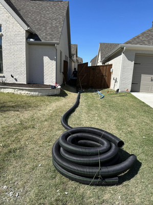 French Drains - We are the pros when it comes to installing french drains and layering a nice rock pathway over it if that is your desired outcome. We can also just install the french drains on a grass area without adding rocks. Get a quick quote by texting us today!