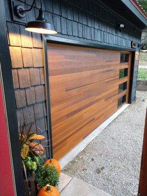 Planks Modern Garage Doors - If you like the look of wooden garage doors but don’t want the maintenance, a wood-look door could be the perfect match for your home.
The recessed grooves create subtle planks that add texture and depth to this contemporary door. Planks Modern Garage Doors - If you like the look of wooden garage doors but don’t want the maintenance, a wood-look door could be the perfect match for your home.
The recessed grooves create subtle planks that add texture and depth to this contemporary door.