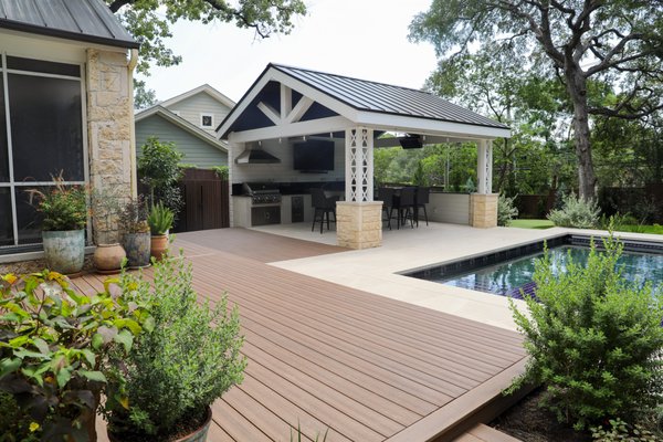 Outdoor living - This is a custom designed outdoor living space with a composite deck, custom steel patio cover and outdoor kitchen to die for. From planning to permitting in the city of Austin new WUI code compliance to the finished product this one came out amazing. This thing has every appliance know to outdoor kitchens including warmers, smokers, vent hoods, grill and more to the patio cover itself with Gas heaters for the cold winter days and cooling fans for the summer heats this thing has it all. Outdoor living - This is a custom designed outdoor living space with a composite deck, custom steel patio cover and outdoor kitchen to die for. From planning to permitting in the city of Austin new WUI code compliance to the finished product this one came out amazing. This thing has every appliance know to outdoor kitchens including warmers, smokers, vent hoods, grill and more to the patio cover itself with Gas heaters for the cold winter days and cooling fans for the summer heats this thing has it all.