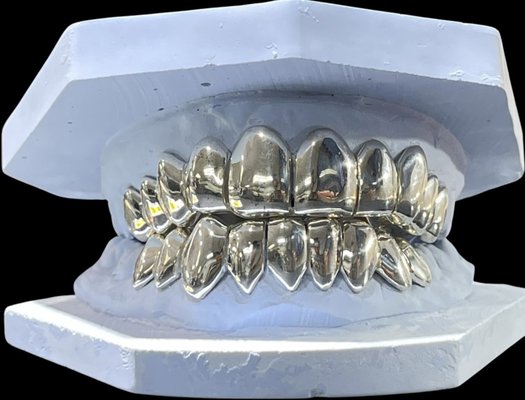 Simple Grillz Menu - Custom Grillz Menu

Explore our selection of custom grillz, handcrafted to fit your smile. We offer a variety of styles, materials, and stone options to match any look—from clean and subtle to fully customized statement pieces.

Available Materials:
• Silver
• Silver Moissanite
• 10K Gold
• 14K Gold
• 10K Gold Moissanite

Popular Styles:
• Open Face
• Solid Fronts
• Fangs
• Honeycomb
• Diamond Cut
• Custom Designs
• Moissanite Sets
• Fully Flooded Sets

Every set is custom-made from professional molds or digital scans to ensure a precise fit and comfortable wear. Whether you’re looking for a single tooth, a partial set, or a full top and bottom grill, each piece is designed specifically for you.

Visit AZGrillzPlug.com to learn more about available styles and custom options.