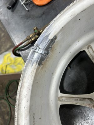 Wheel repair - Cut out crack in wheel, preheated it, then welded it and took down high spots with a grinder. Wheel repair - Cut out crack in wheel, preheated it, then welded it and took down high spots with a grinder.