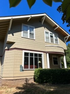 Exterior of 1890's historical home - This home from the 1890's was a work of love. It needed some siding repairs, all the storm windows removed, new gutters which we helped with through a sub-contractor. We then prepped and painted it this fresh bluey green that gave it new life.
