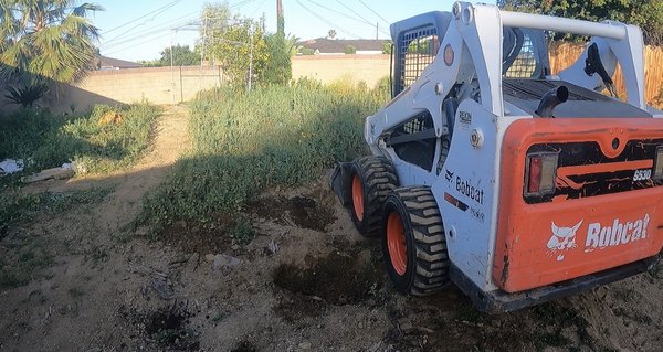 Backyard Cleanup - This home owner wanted to claim their backyard that was full of tall weeds, chopped wood, mountains of dirt, and miscellaneous junk. Backyard Cleanup - This home owner wanted to claim their backyard that was full of tall weeds, chopped wood, mountains of dirt, and miscellaneous junk.