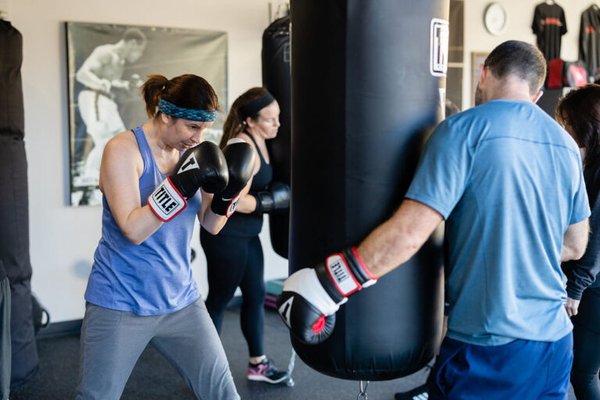 PREMIER BOXING & FITNESS - Become the most powerful version of yourself, one punch at a time. - Do you want to begin an amazing journey? Boxing at our gym is more than just learning to punch a bag. 1-on-1 classes with our trainers offer a highly personalized workout — both physically and mentally — that is hard to get anywhere else.
Your trainer will specifically design your routines to address what you need to improve. Plus, they will ensure you fully understand each exercise and perform each rep flawlessly, significantly lowering your risk of injury. They will also motivate you when you’re flagging, spurring you on to the type of high-intensity you might only have dreamed about before.
Beyond physical training, your trainer will help you learn to master your mental technique — which can be just as important or perhaps more than the physical component. PREMIER BOXING & FITNESS - Become the most powerful version of yourself, one punch at a time. - Do you want to begin an amazing journey? Boxing at our gym is more than just learning to punch a bag. 1-on-1 classes with our trainers offer a highly personalized workout — both physically and mentally — that is hard to get anywhere else.
Your trainer will specifically design your routines to address what you need to improve. Plus, they will ensure you fully understand each exercise and perform each rep flawlessly, significantly lowering your risk of injury. They will also motivate you when you’re flagging, spurring you on to the type of high-intensity you might only have dreamed about before.
Beyond physical training, your trainer will help you learn to master your mental technique — which can be just as important or perhaps more than the physical component.