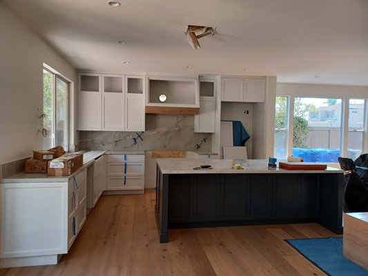 Fine Finish 2022 - New cabinetry throughout the house; pigmented lacquer kitchen, bathroom vanity and laundry-room. Custom stain match; kitchen range band, fireplace mantle, and master-bathroom vanities.
