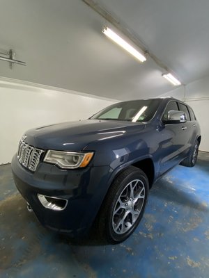 Ceramic Coating on Jeep Grand Cherokee - This Jeep Grand Cherokee received our Ceramic Coating Package which includes a detailed wash and stripping process which cleans the vehicle and removes any previous wax applications that were previously on the vehicle, followed by taping off any trim that could be marked up with compounds and polishes. The vehicle then is buffed and polished to remove any swirls and scratches using only the finest equipment and products. The paint is then prepped to clean off any oils, residue and fillers. The ceramic coating is then applied to the vehicle worked in small sections and covering all painted surfaces, headlights, tail lights and plastics. The vehicle is then kept indoors to cure for at least 24 hours before taken on the road again.
A ceramic coating is an incredible paint protection coating that if you plan on having a vehicle for a while, this service is for you! Our ceramic coating process will ensure that your paint and vehicle will not only add incredible shine and depth, but will protect it from weather, environmental fallout, and more. The coating is extremely hydrophobic meaning water will bead incredibly and simply glide off your vehicle. This coating will also make washing your vehicle a lot easier and quicker.
Contact us today and schedule your vehicle for a ceramic coating! Ceramic Coating on Jeep Grand Cherokee - This Jeep Grand Cherokee received our Ceramic Coating Package which includes a detailed wash and stripping process which cleans the vehicle and removes any previous wax applications that were previously on the vehicle, followed by taping off any trim that could be marked up with compounds and polishes. The vehicle then is buffed and polished to remove any swirls and scratches using only the finest equipment and products. The paint is then prepped to clean off any oils, residue and fillers. The ceramic coating is then applied to the vehicle worked in small sections and covering all painted surfaces, headlights, tail lights and plastics. The vehicle is then kept indoors to cure for at least 24 hours before taken on the road again.
A ceramic coating is an incredible paint protection coating that if you plan on having a vehicle for a while, this service is for you! Our ceramic coating process will ensure that your paint and vehicle will not only add incredible shine and depth, but will protect it from weather, environmental fallout, and more. The coating is extremely hydrophobic meaning water will bead incredibly and simply glide off your vehicle. This coating will also make washing your vehicle a lot easier and quicker.
Contact us today and schedule your vehicle for a ceramic coating!