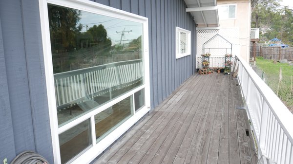 Greenbrae Transformation - This home on a hillside above the 101 Freeway in Greenbrae had the original aluminum windows from 1957! You could hear every car on the road below. The client was thrilled when the new, dual pane windows were installed.  Even with a door open, the house was much quieter.