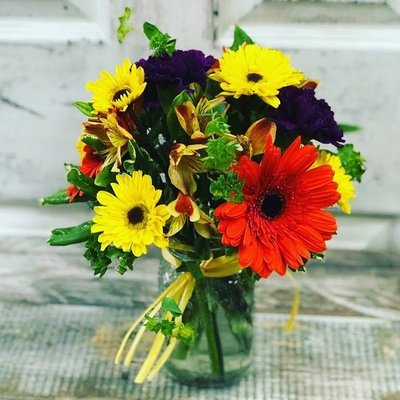 Our Signature Mason Jars - Our Best Seller is collection of seasonal bright wildflowers in a small 500ml mason jar. Seasonal flowers will vary. This is perfect for a thoughtful small gift- to sit on a side table or office desk. Our Signature Mason Jars - Our Best Seller is collection of seasonal bright wildflowers in a small 500ml mason jar. Seasonal flowers will vary. This is perfect for a thoughtful small gift- to sit on a side table or office desk.