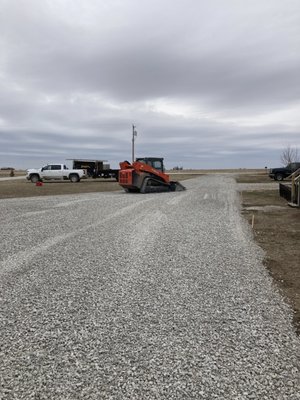 New Driveway #1354 - Installed a new culvert in road ditch. And made a big horseshoe drive so they could pull trucks and trailers through without having to turn them around or back out onto the main road. Also made a trailer parking area off to the side