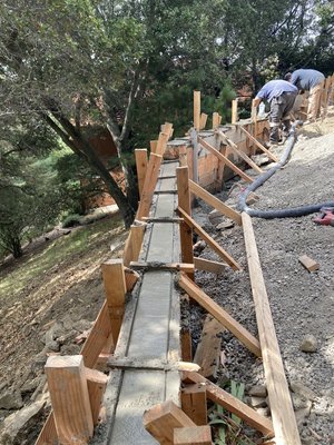 Retaining Wall in Montclair - This project is the construction of a concrete retaining wall to retain the hillside. Retaining Wall in Montclair - This project is the construction of a concrete retaining wall to retain the hillside.