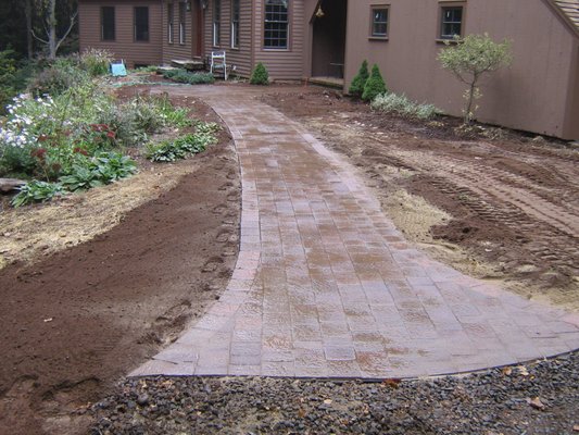 Outer Ridge Rd - North Haven Paver Walkways - The front walkway of this house was in need or repair or replacement. Client choose to replace with a brown paver walkway. TJB-INC also added a flair to what was a 3' wide rear walkway to make it more inviting to visitors. A stepping stone pathway was installed along the rear of the house using Maya Stepping stones. Outer Ridge Rd - North Haven Paver Walkways - The front walkway of this house was in need or repair or replacement. Client choose to replace with a brown paver walkway. TJB-INC also added a flair to what was a 3' wide rear walkway to make it more inviting to visitors. A stepping stone pathway was installed along the rear of the house using Maya Stepping stones.