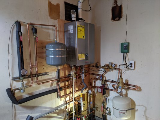 Radiant Heat System Installation - Installing a radiant heat system for domestic hot water and heating up the house. Radiant Heat System Installation - Installing a radiant heat system for domestic hot water and heating up the house.