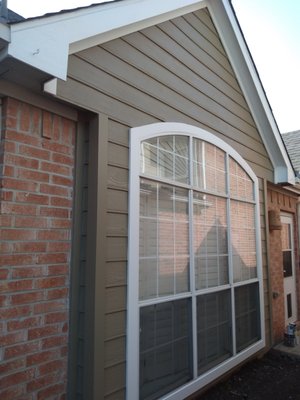 Siding and trim restoration - The siding, trim and paint around these windows were in bad shape. It turned out beautiful in the end