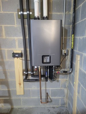 tankless water heater installation - Old tank style water heater removed from resident's basement and tankless style water heater was put in its place. tankless water heater installation - Old tank style water heater removed from resident's basement and tankless style water heater was put in its place.