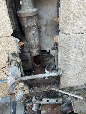 Drain Repairs - We diagnosed a leak appearing outside whenever the kitchen faucet was running as a drain leak. We opened the stucco and found a temporary patch had been installed over this hole in the drain pipe at some point in the past and was now leaking.
We replaced the section of drain pipe adding a cleanout for future snaking access. We also noticed a corroded water pipe and gave the option to repair that while the wall was open and installed a new hose bib as well. Drain Repairs - We diagnosed a leak appearing outside whenever the kitchen faucet was running as a drain leak. We opened the stucco and found a temporary patch had been installed over this hole in the drain pipe at some point in the past and was now leaking.
We replaced the section of drain pipe adding a cleanout for future snaking access. We also noticed a corroded water pipe and gave the option to repair that while the wall was open and installed a new hose bib as well.