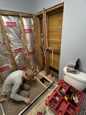 Linda’s - Old tub to shower conversion. Installed walk in shower with sliding glass doors. Fold down ada shower seat. Grab bar for stability.
