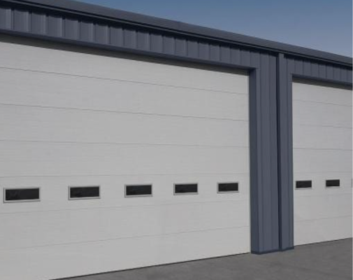 Sectional Doors - We have a wide selection of quality commercial sectional garage door options. You can choose if it will be insulated or not, the size, and you can specify if you have any color needs. There are even options for personnel doors to be part of your sectional door to ease access without the need to open the entire door.
Whether you haven't had the doors maintained in a while, you need some parts replacing or you need several new doors installed with a very quick turnaround, let our experts deliver sectional doors safe and trouble-free for years to come. Sectional Doors - We have a wide selection of quality commercial sectional garage door options. You can choose if it will be insulated or not, the size, and you can specify if you have any color needs. There are even options for personnel doors to be part of your sectional door to ease access without the need to open the entire door.
Whether you haven't had the doors maintained in a while, you need some parts replacing or you need several new doors installed with a very quick turnaround, let our experts deliver sectional doors safe and trouble-free for years to come.