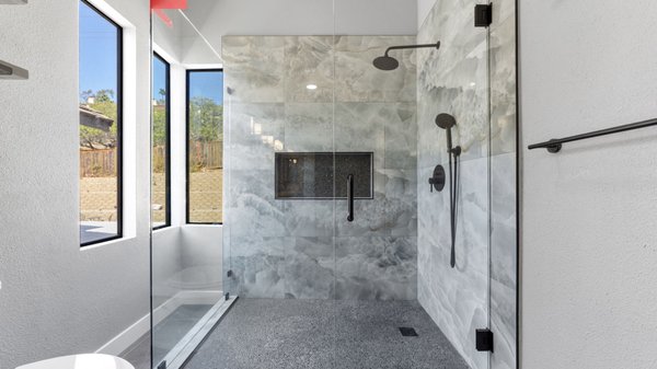 Master Bathroom Remodeling - Carlsbad - Beautiful master bathroom remodel in Carlsbad, CA, featuring a custom double-sink vanity, elegant quartz countertops, modern tile finishes, and a luxurious walk-in shower with frameless glass doors and matte black fixtures. A perfect blend of modern design, comfort, and functionality by 3 Day Kitchen & Bath.