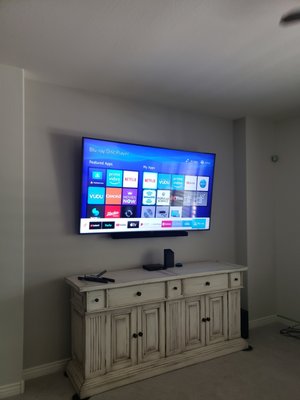 82 inch TV with sound soundbar mounted to the TV of a full motion mount with all cables concealed - 82 inch TV mounted on a full motion mount with sound mounted to TV and all cables concealed 82 inch TV with sound soundbar mounted to the TV of a full motion mount with all cables concealed - 82 inch TV mounted on a full motion mount with sound mounted to TV and all cables concealed