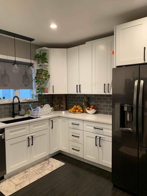 complete kitchen project with beautiful white shaker ￼￼ - New hardwood flooring , cabinets white shaker , backsplash ￼and quartz countertop we did it all