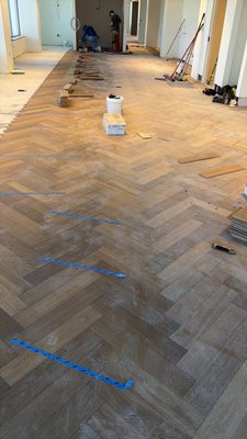 Herringbone Law office - Commercial remodel of the Baker Donelson law office in downtown Memphis, including the installation of engineered hardwood flooring in a herringbone pattern. The project focused on precision layout, clean transitions, and a high-end finish suited for a professional office environment. Herringbone Law office - Commercial remodel of the Baker Donelson law office in downtown Memphis, including the installation of engineered hardwood flooring in a herringbone pattern. The project focused on precision layout, clean transitions, and a high-end finish suited for a professional office environment.