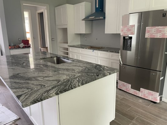 Grey Juparana countertops remodel - This remodel was done on new kitchen countertops, bathroom and laundry. Grey Juparana countertops remodel - This remodel was done on new kitchen countertops, bathroom and laundry.